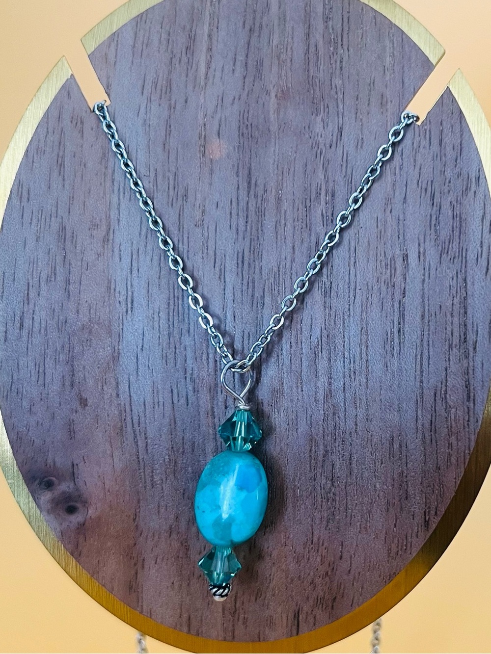 Oval turquoise & crystals pendant set in silver plus a stainless steel necklace